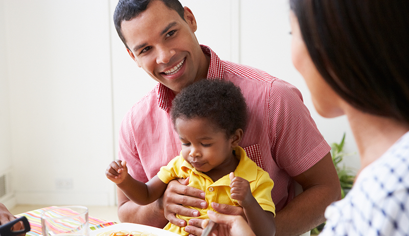 Family Eating Meal Together At Home